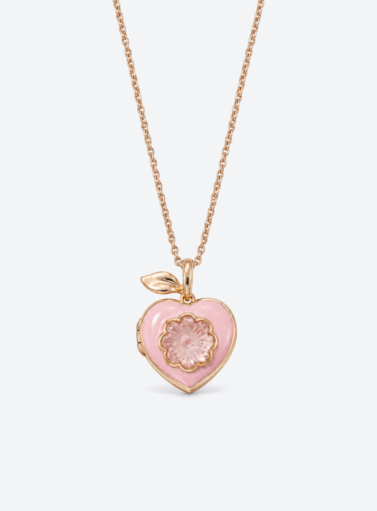 Pink heart locket necklace with gold-tone leaf detail at the top of the pendant (Flower)