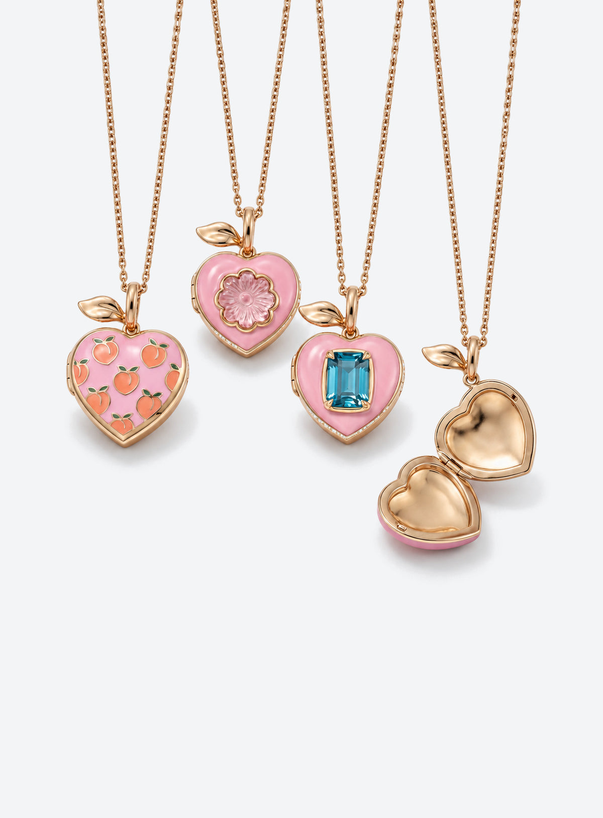Pink heart locket necklace with gold-tone leaf detail at the top of the pendant