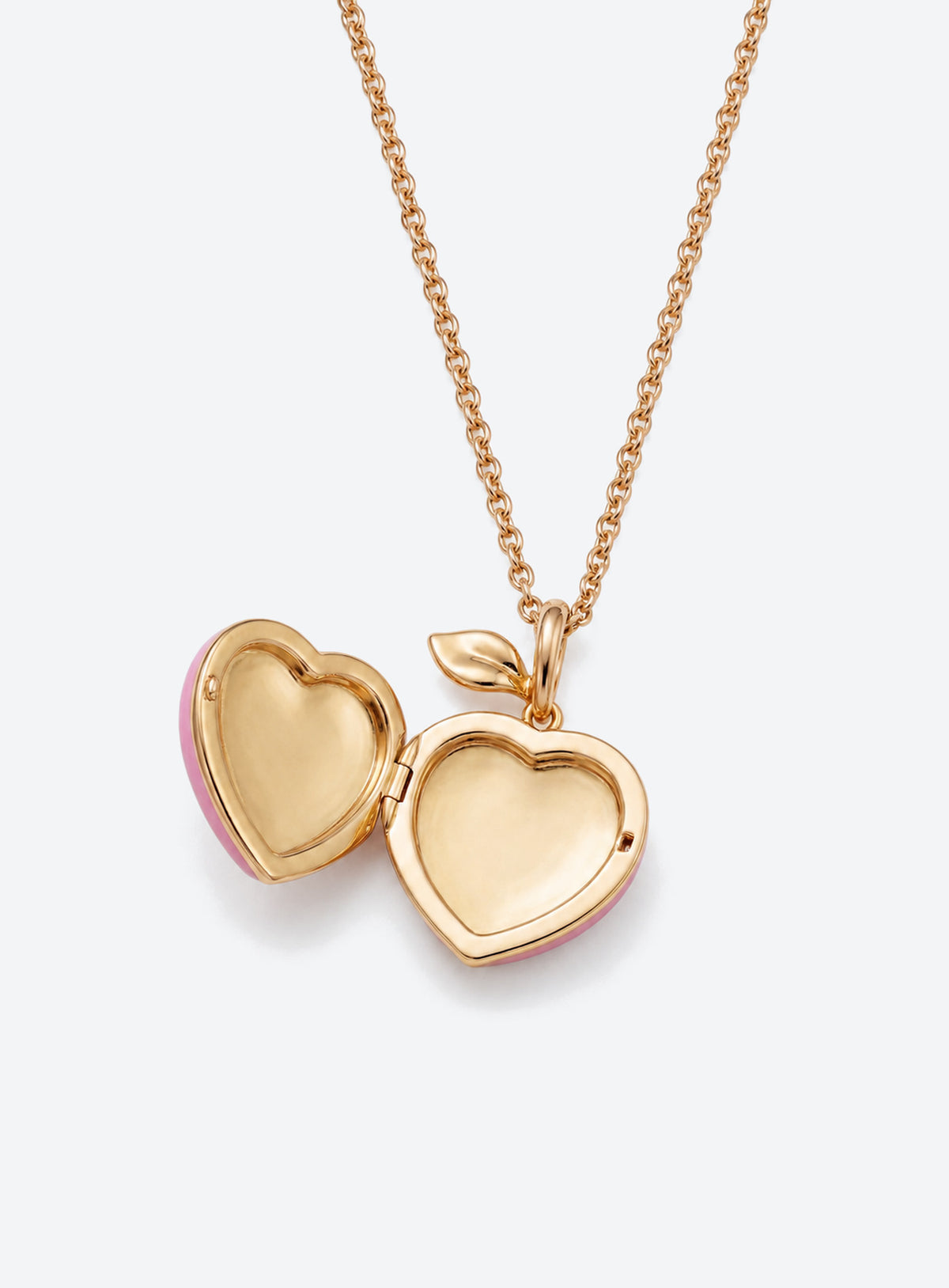 Pink heart locket necklace with gold-tone leaf detail at the top of the pendant