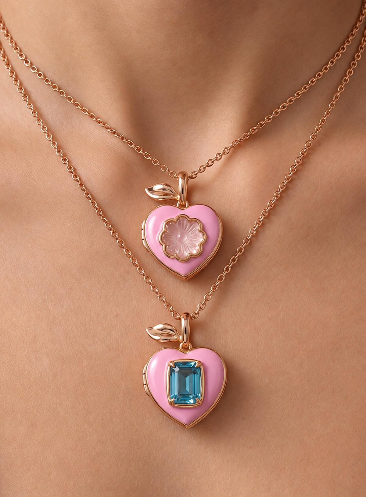 Pink heart locket necklace with gold-tone leaf detail at the top of the pendant