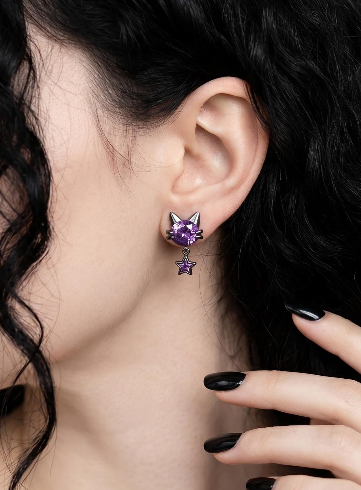 Gothic purple cat stud earrings with dangling star details on a clean studio background