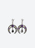 Pair of silver-finish earrings with purple flowers on dark crescents and hanging black teardrop stones.