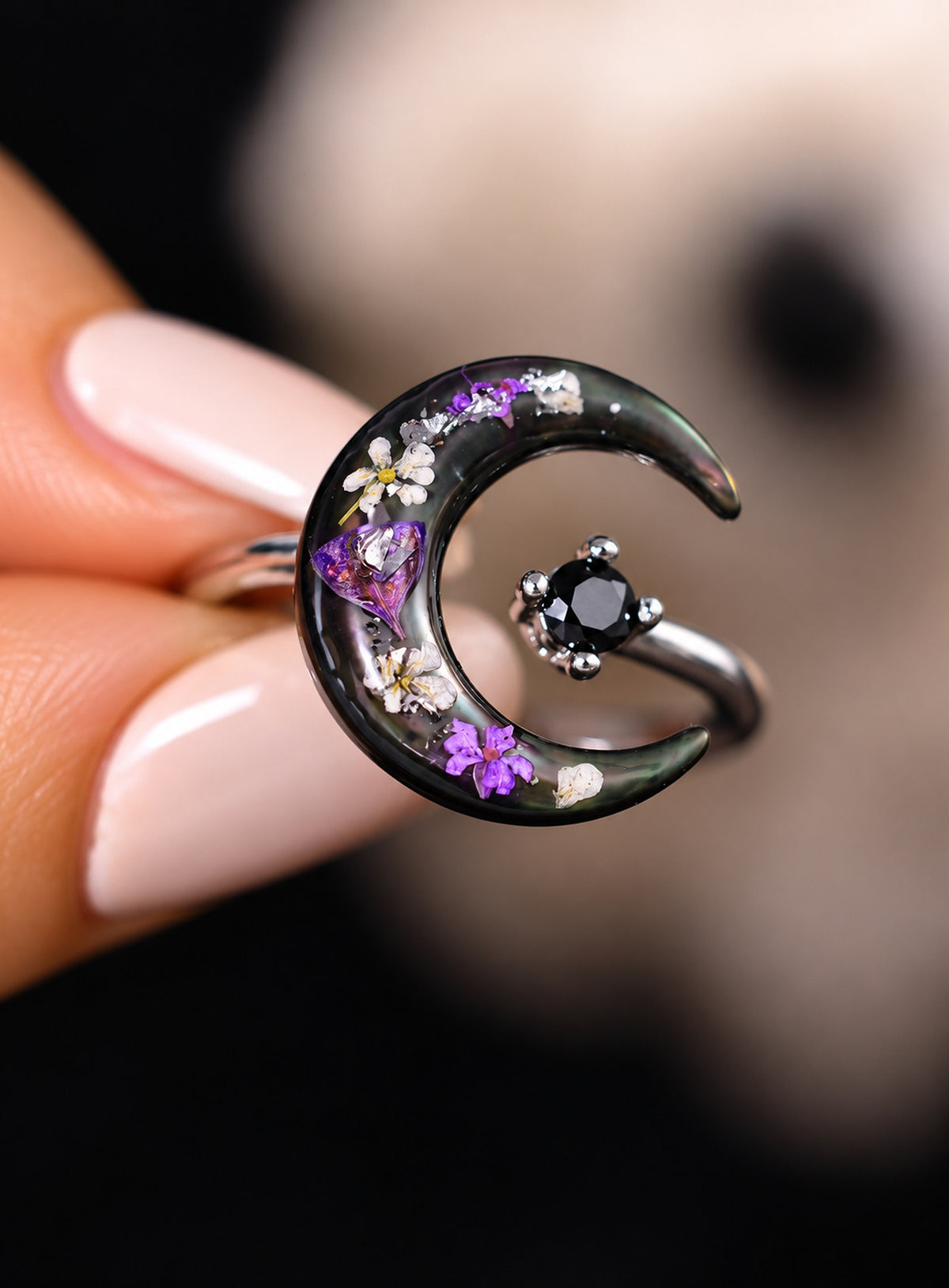 Silver-finish open ring with a dark crescent, purple pressed flowers and a black stone. (Silver)
