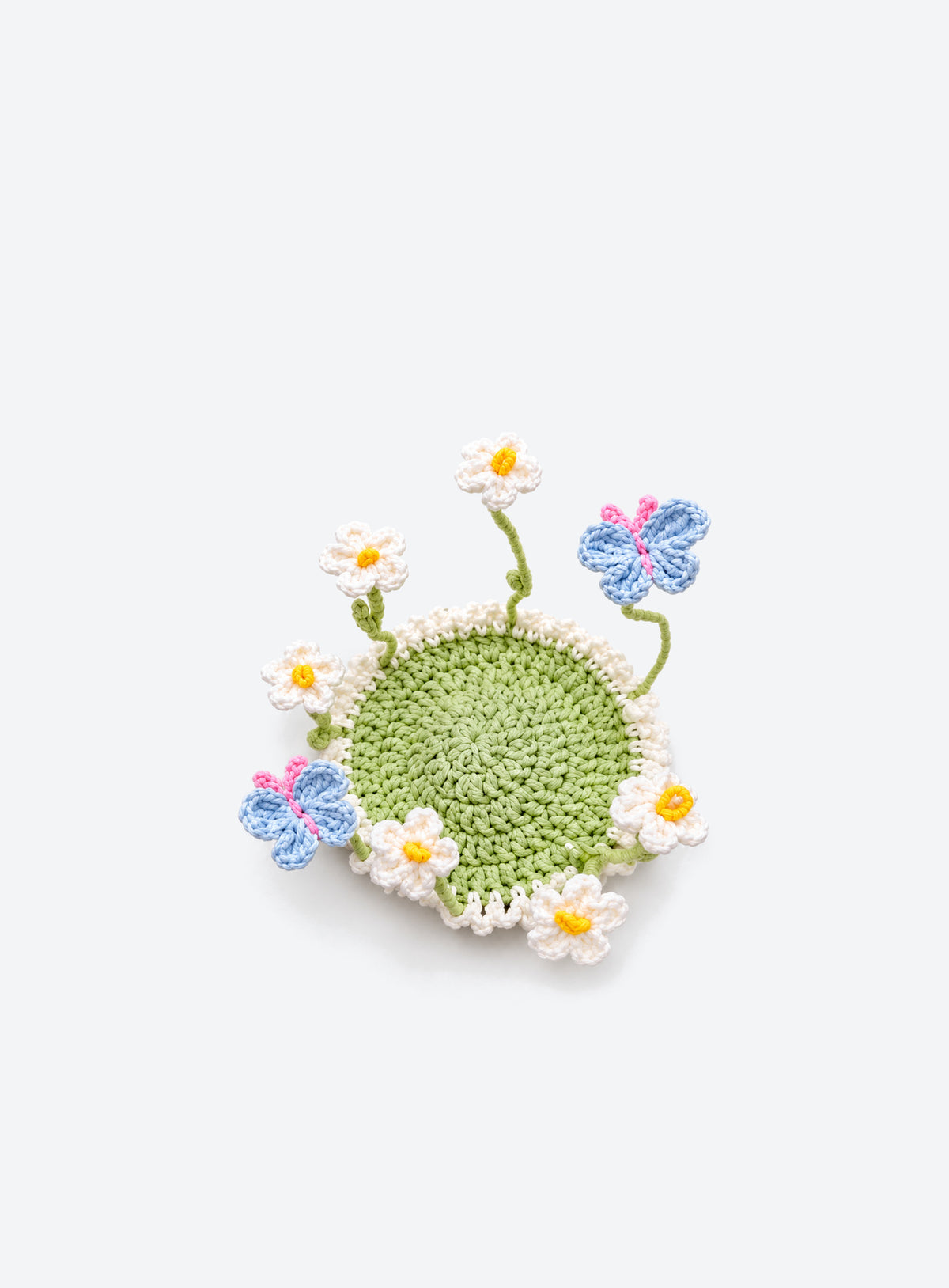 Handmade crochet coaster with raised decorative motifs around the edge (Daisy & Butterfly)