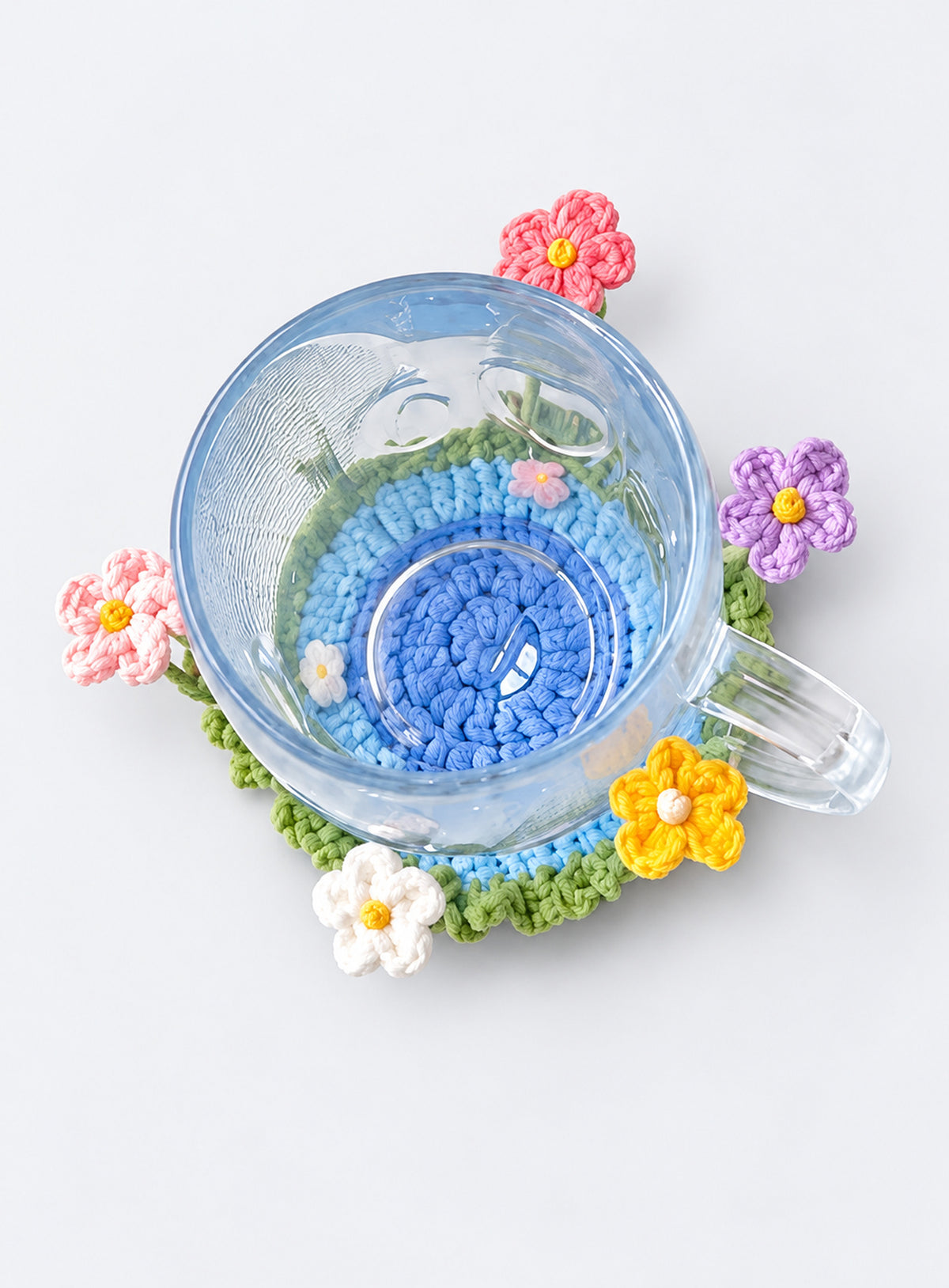 Handmade crochet coaster with raised decorative motifs around the edge (Mixed Daisies)