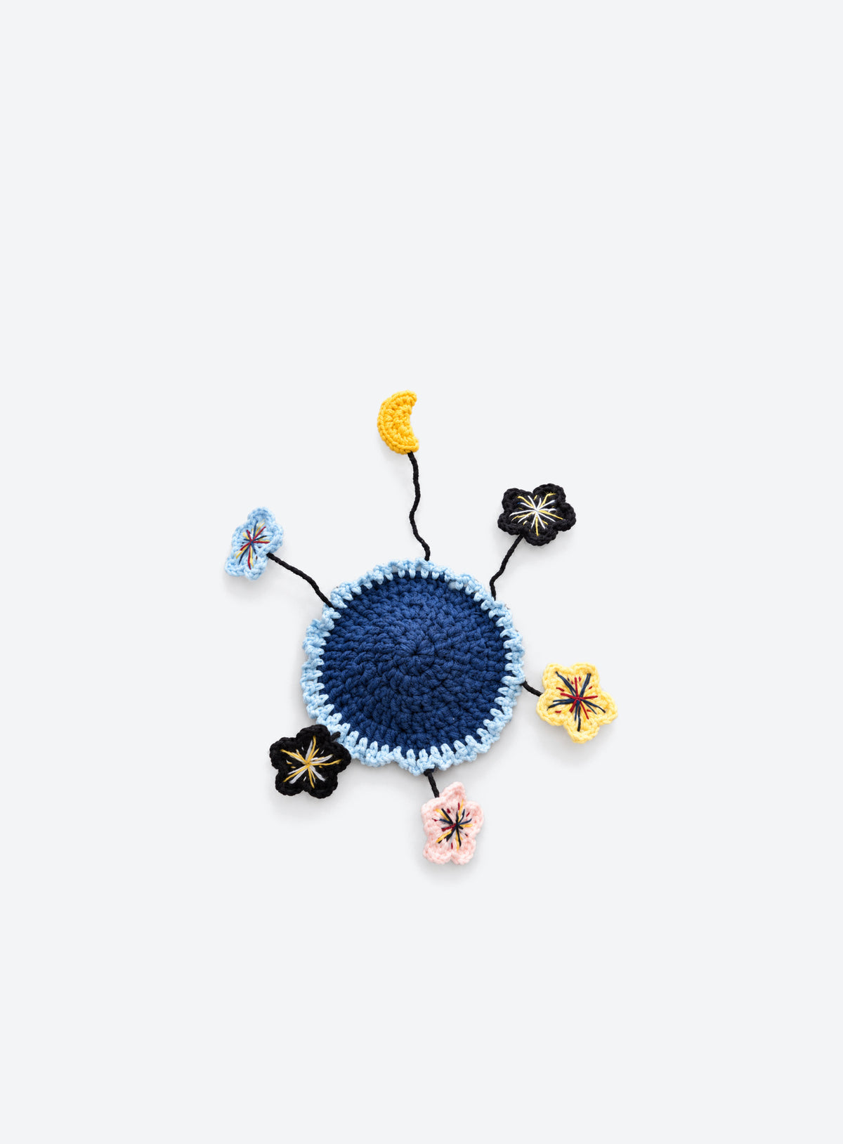 Handmade crochet coaster with raised decorative motifs around the edge (Moon & Colorful Stars)