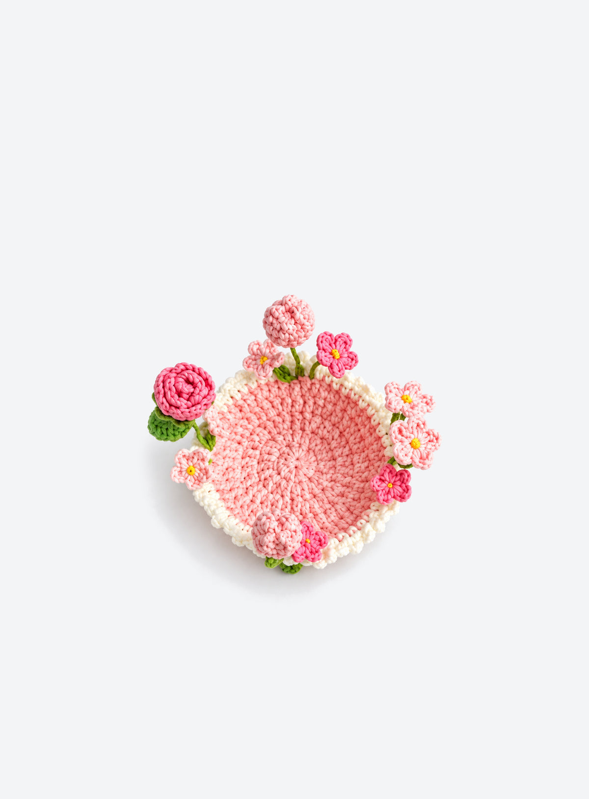 Handmade crochet coaster with raised decorative motifs around the edge (Mixed Flowers)