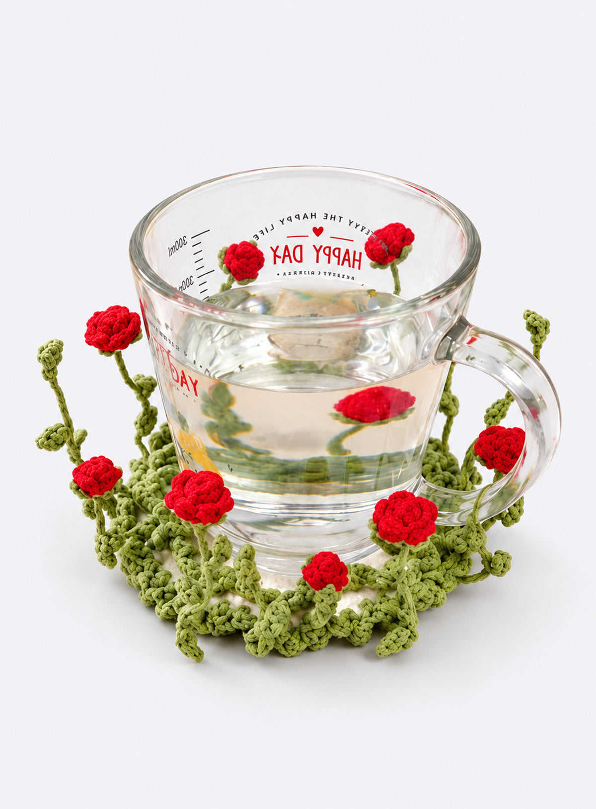 Handmade crochet coaster with raised decorative motifs around the edge (Red Rose)