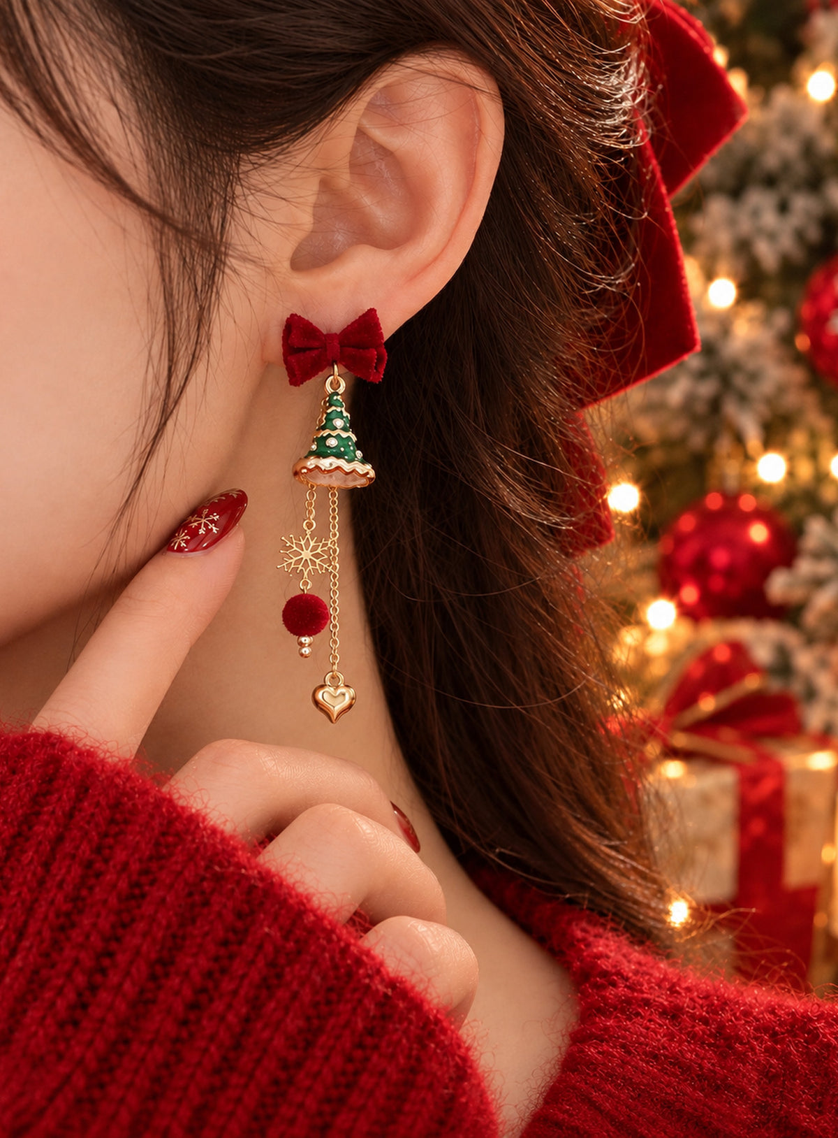 Asymmetric earrings with red velvet bows, green trees, gold-tone chains, snowflakes, red pom-poms and a heart