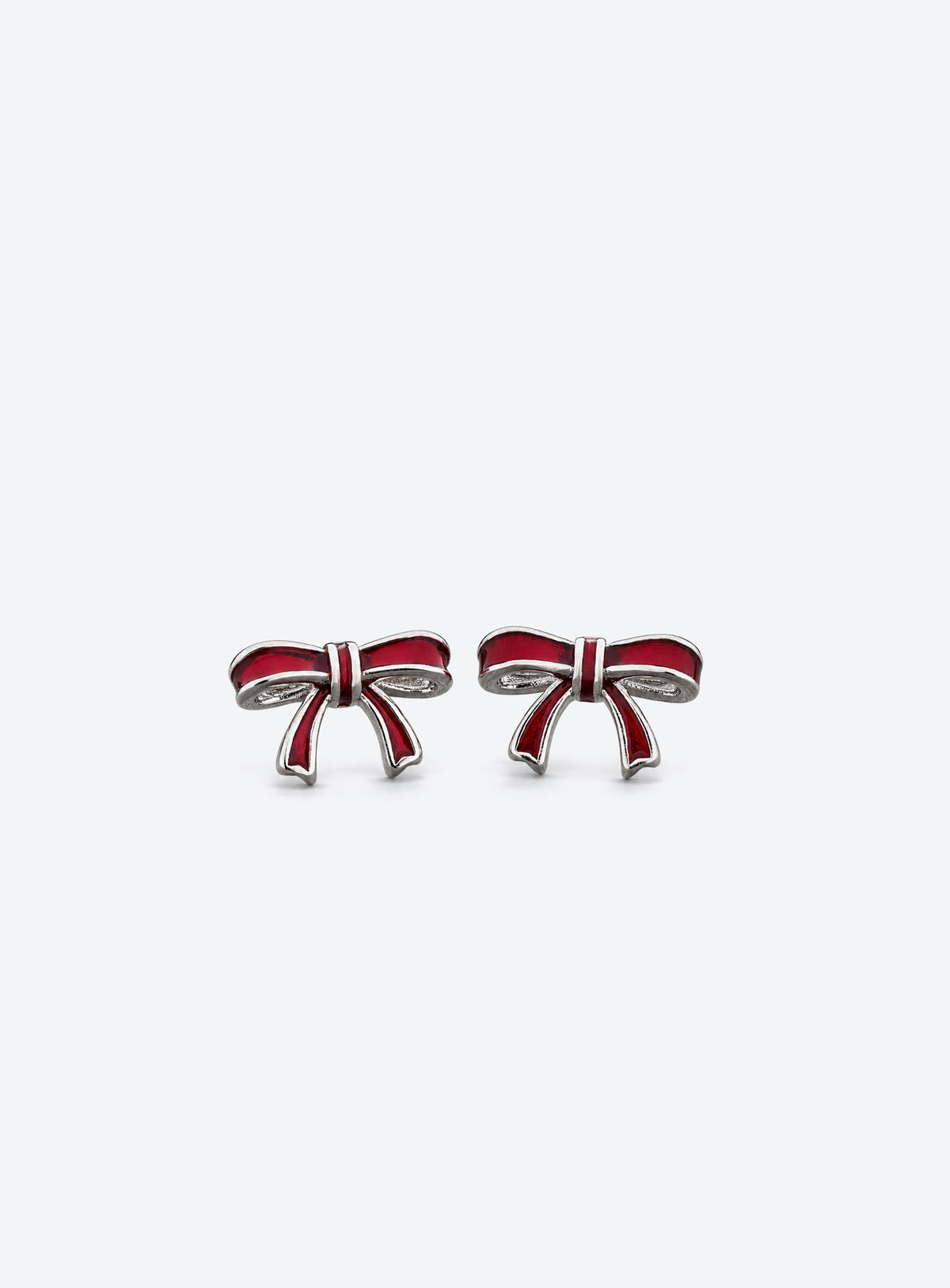 Pair of red enamel bow stud earrings with vintage silver-tone edges