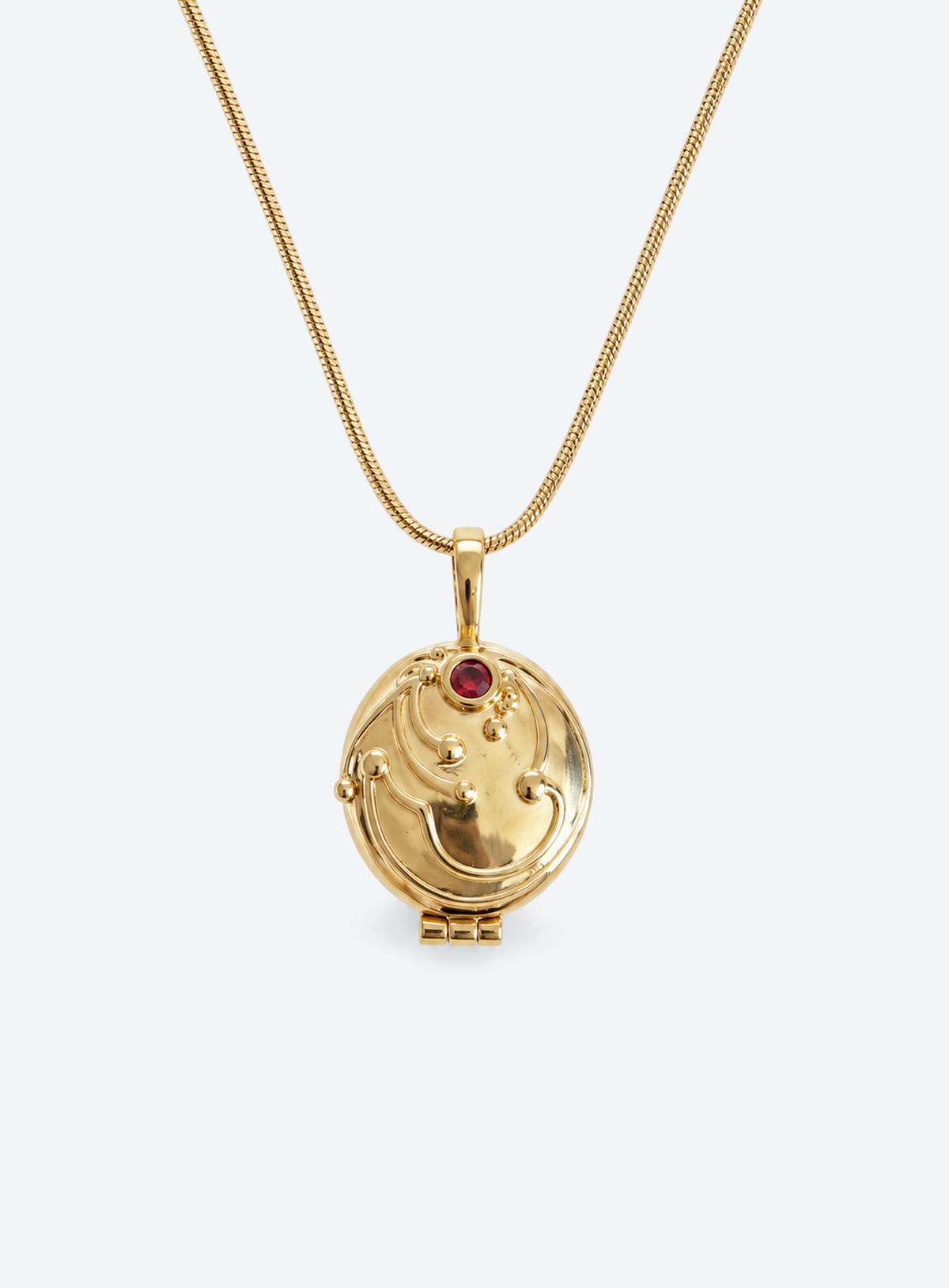 Gothic locket pendant with a red stone on a chain