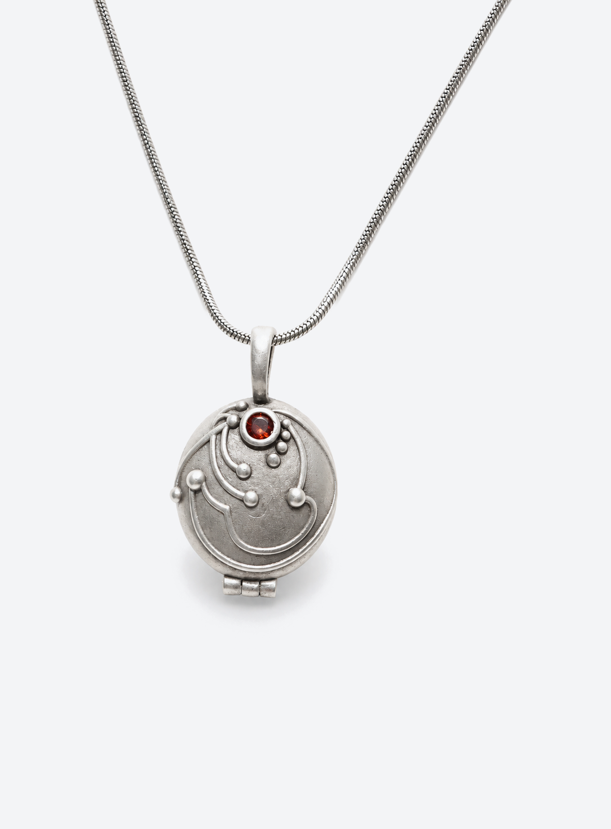 Gothic locket pendant with a red stone on a chain