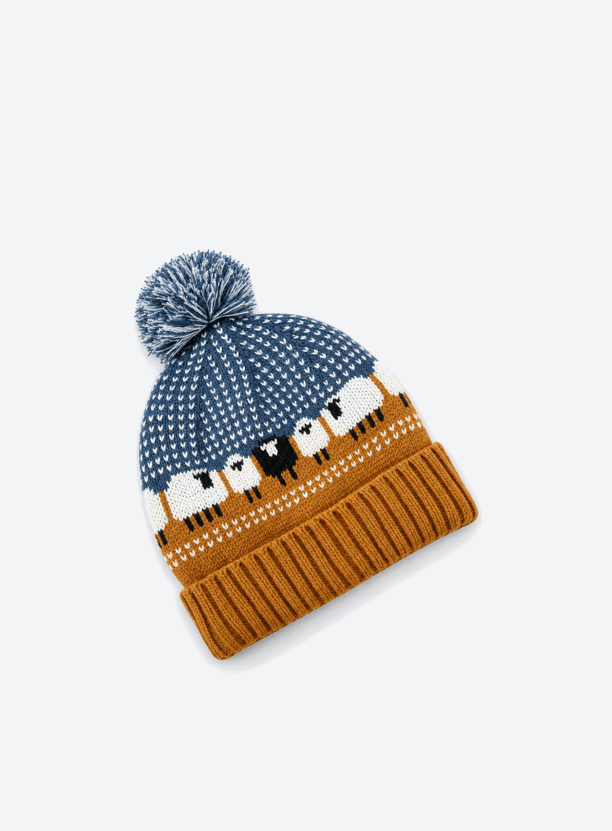 Bright blue pom-pom beanie with ochre ribbed cuff and black-and-white sheep motifs