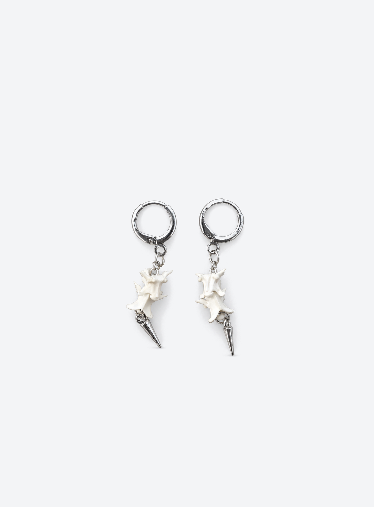 Silver-tone hoop earrings with snake vertebrae and metal spike drops