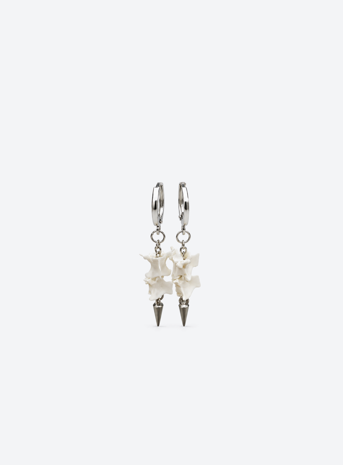 Silver-tone hoop earrings with snake vertebrae and metal spike drops