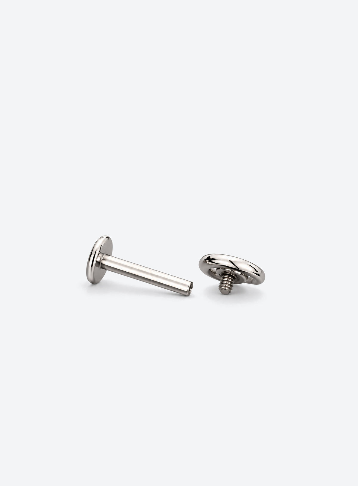 Single flat back stud earring with a spiral front