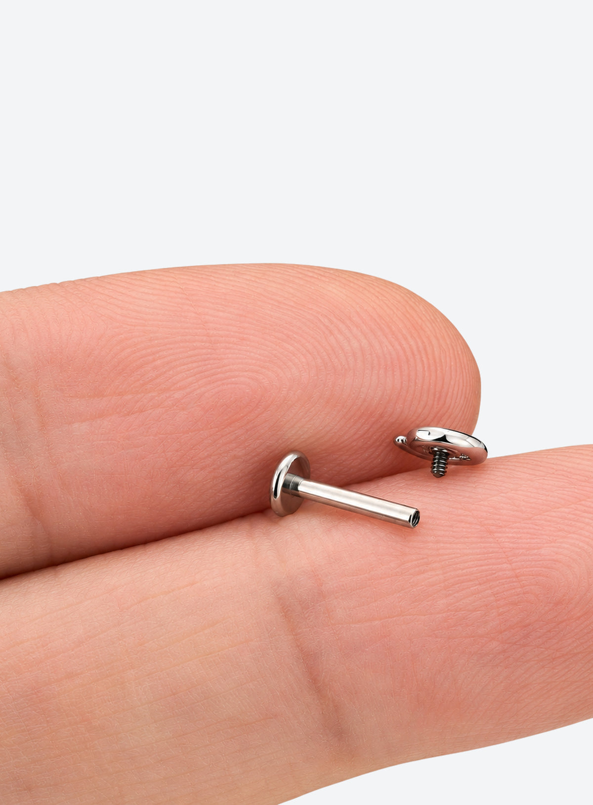 Single flat back stud earring with a spiral front