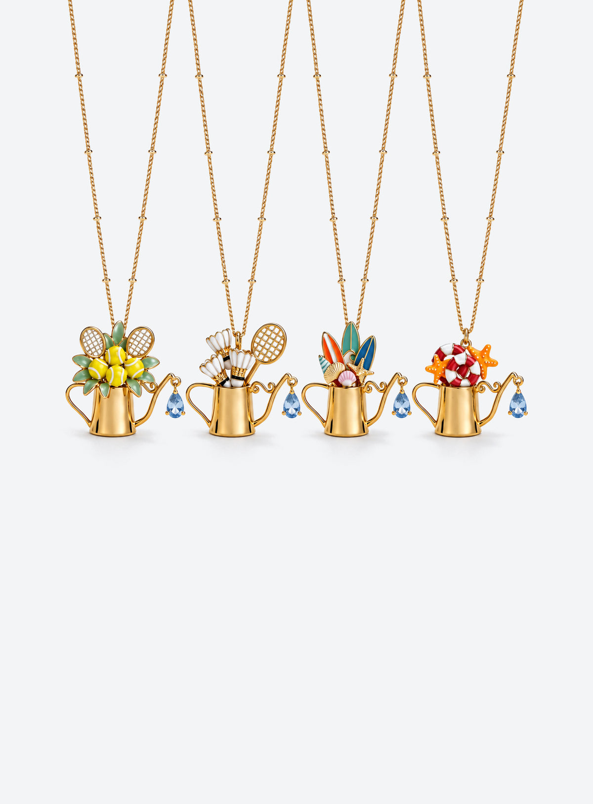 Gold-tone watering can pendants with sport and beach decorations and blue teardrop crystal details