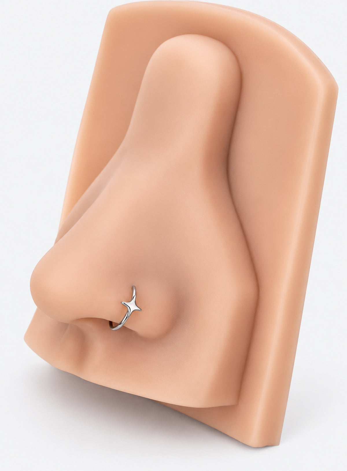 Star detail nose hoop with hinged clicker closure, shown in a studio product photo (Silver)