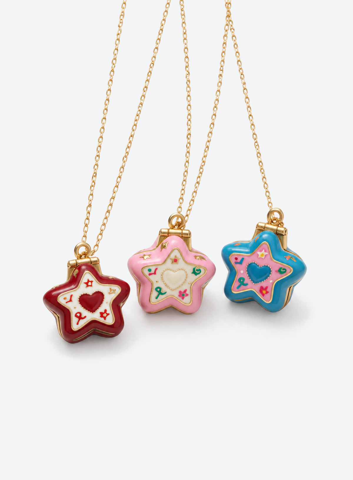 Star-shaped enamel locket necklace with a gold-tone chain and raised decorative motifs