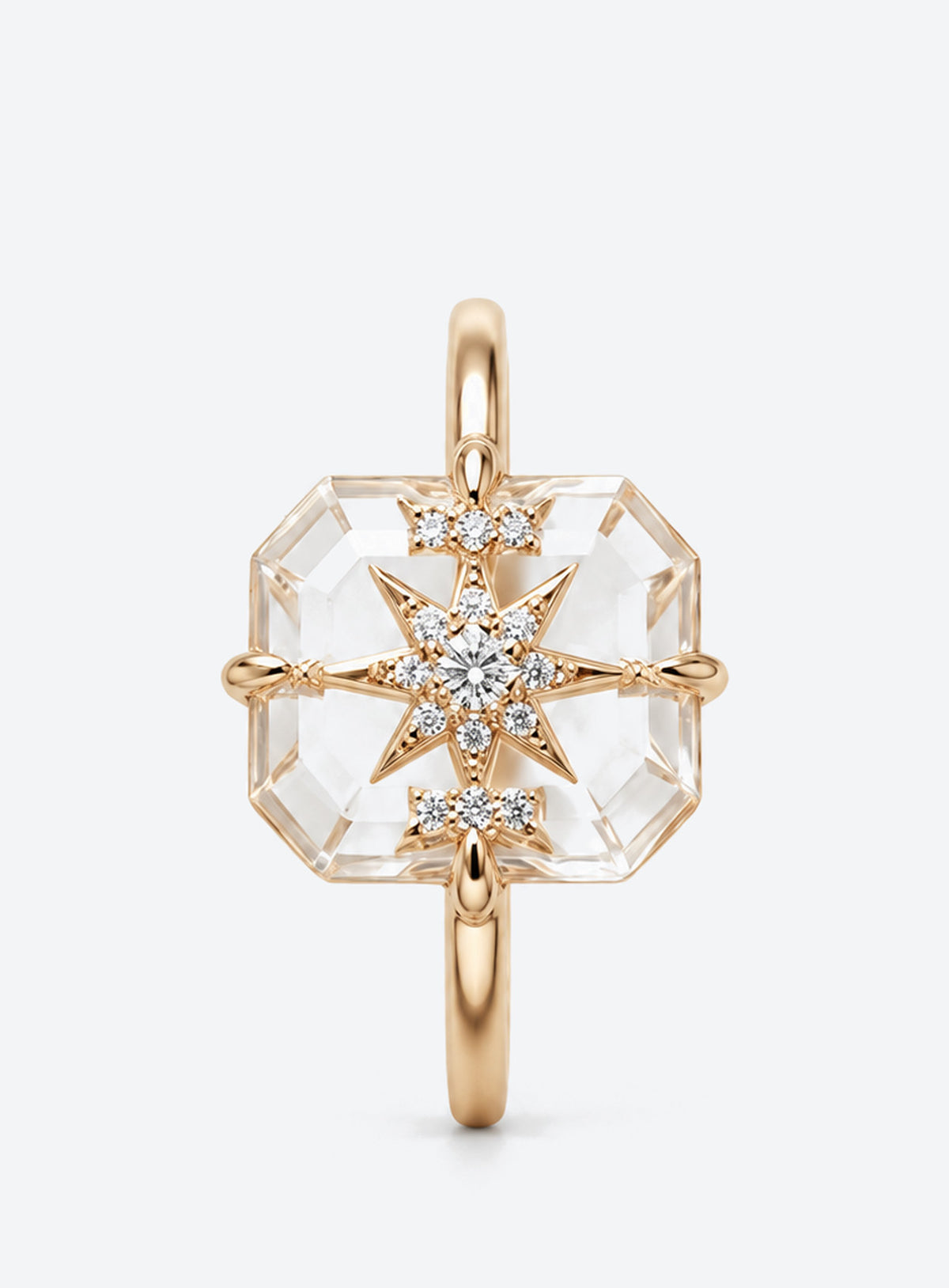 Slim silver or gold ring with clear rectangular centre, starburst motif and small clear accents