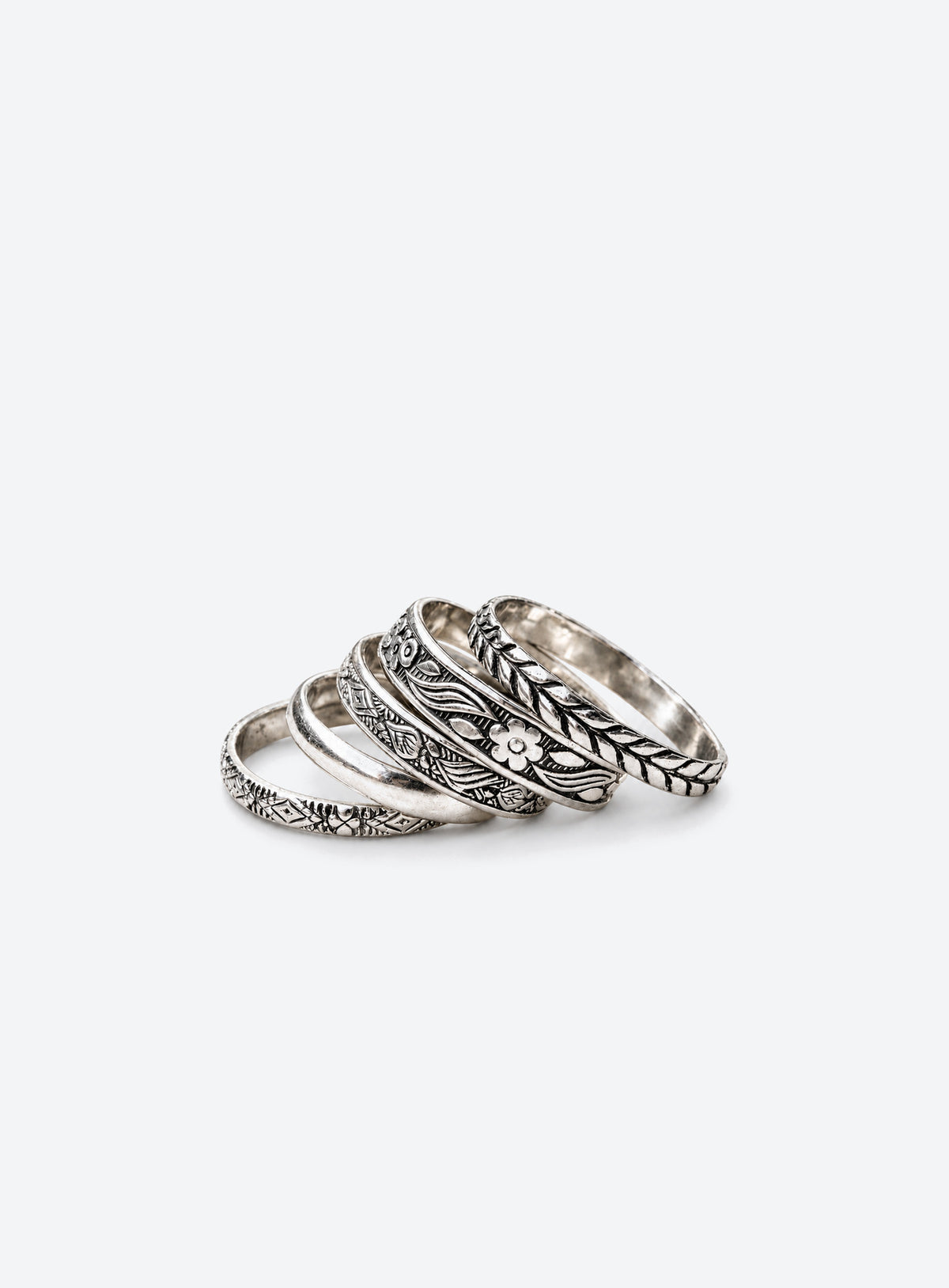 Five sterling silver floral and patterned stacking rings