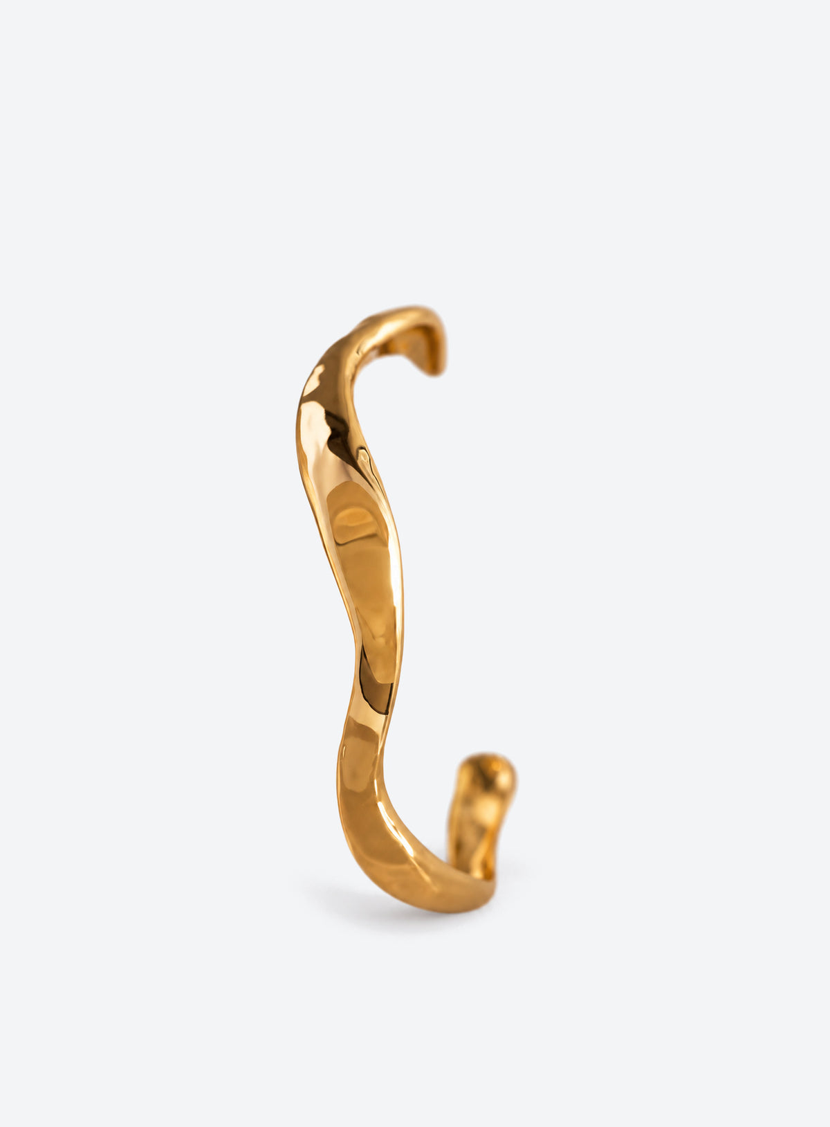 Open cuff bracelet with sculpted wavy edges and a textured polished surface (Gold)