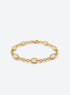 Gold-toned link bracelet with oval white opals, fine beaded bezel edges, and connecting chain links.