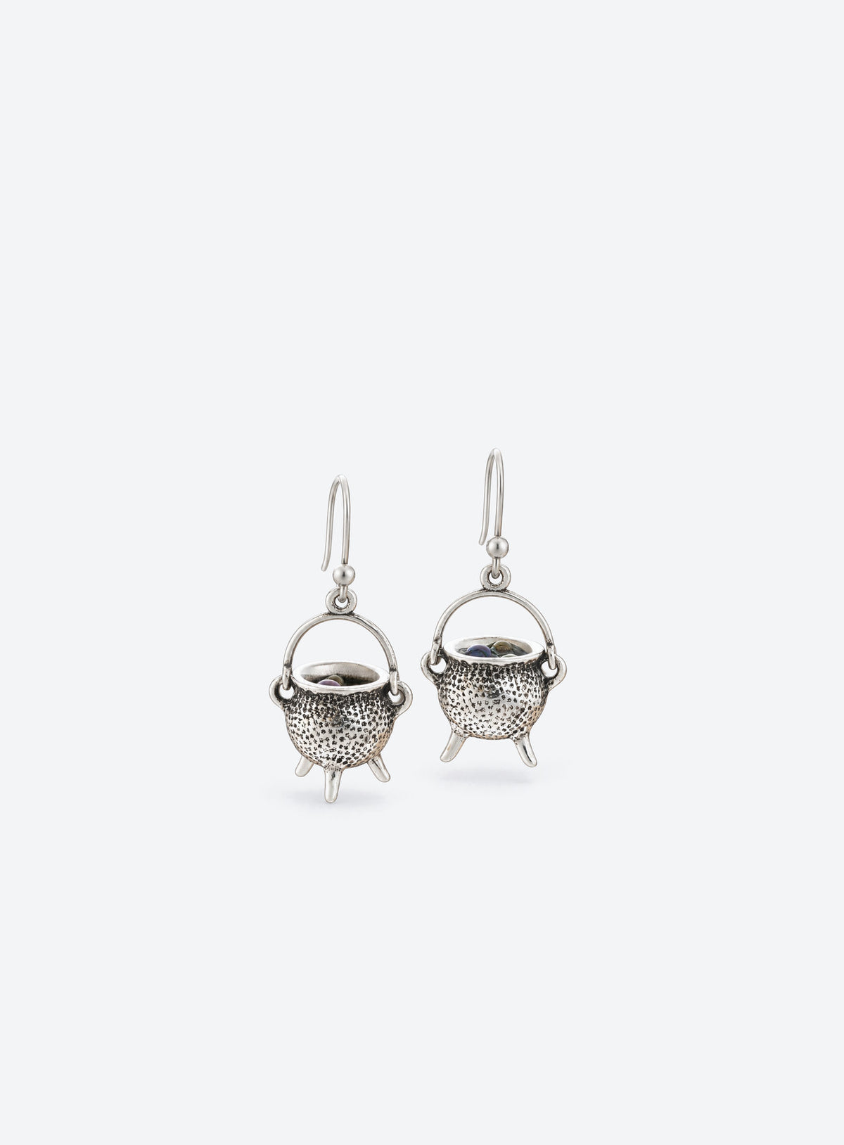 A pair of vintage silver-tone cauldron earrings with curved handles and French ear hooks